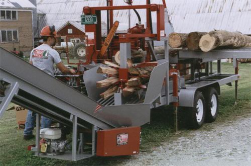 PRO-HD firewood processor with hydraulic chainsaw, top-roll, live deck